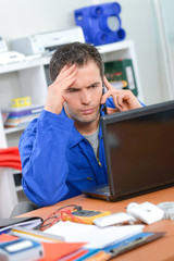 man in front of a laptop