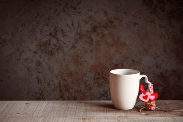 mugs with hearts at wall.