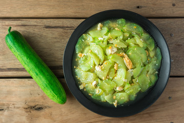Stir Fried Cucumber on wooden table.