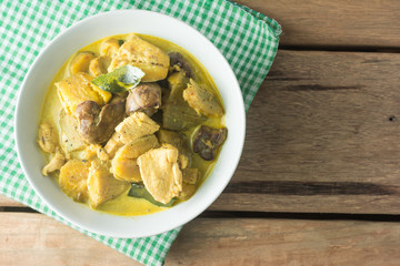 Chicken Curry with Eggplant on wooden table.