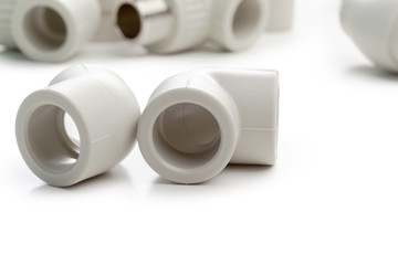 Set of metal-plastic plumbing couplings, adapters, plugs isolated on white background