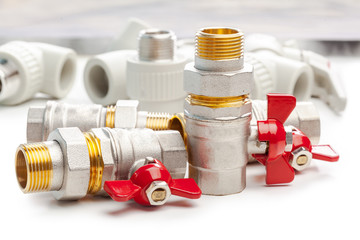 Set of metal-plastic plumbing couplings, adapters, plugs isolated on white background