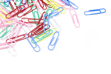 multi-colored paper clips on white background