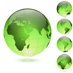 Green glossy globes set isolated on white background.