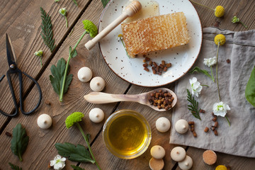 Different type of honey on a wooden background.