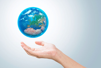 Earth planet in female hand - Elements of this image furnished by NASA