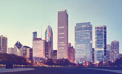 Obraz premium Retro stylized picture of Chicago downtown at twilight.