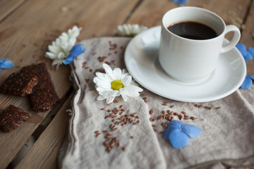 Serving table: fruit bar and cup of black coffee.