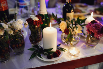 Romantic decorations from candles and flowers