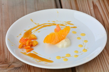 The orange dessert with cream and honey