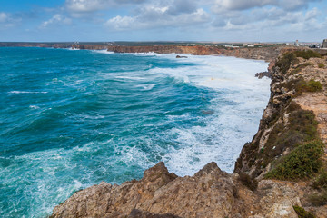Cliffs at Cape Saint Vicent in Algarve region on a windy day. Portugal.