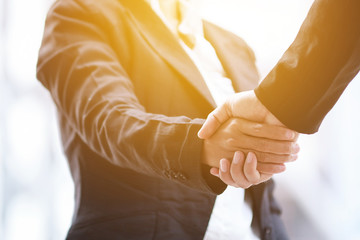 Asia business people handshaking.