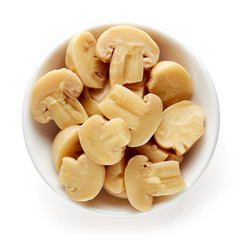 Bowl of pickled mushroom halves from above