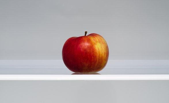 Apple in an empty fridge
