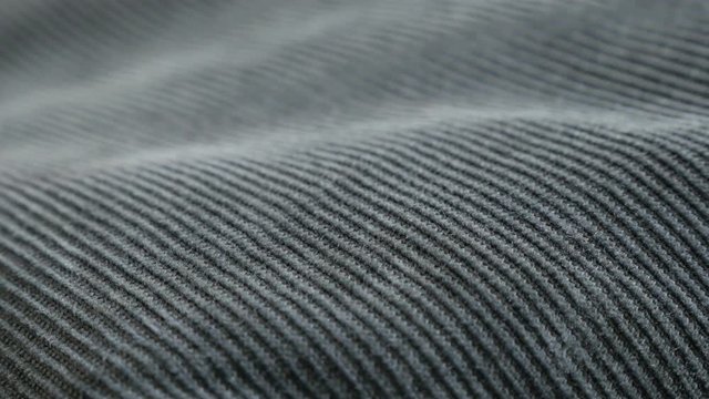 Slow pan on indigo color velvet fabric tufted parallel cords close-up 4K 2160p 30fps UltraHD footage - Panning on dark blue cotton corduroy twisted fibers 3840X2160 UHD video 
