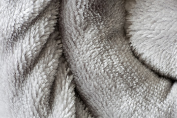 Texture of a rolled up blanket.
