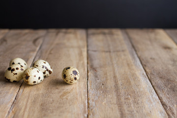 quail eggs on rustic wooden table