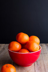 mandarins on red plate