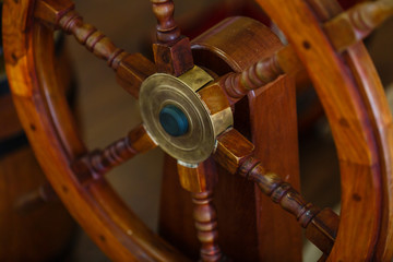 Wooden steering wheel on an old ship