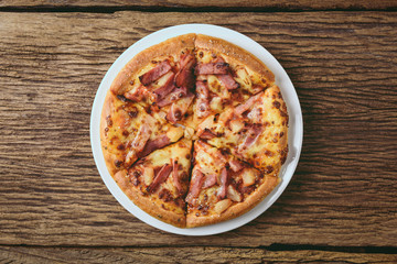 Delicious fresh pizza served on wooden table
