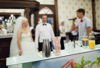 Beautiful stylish newlyweds have fun in the restaurant