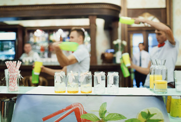 Jars with ribbons on the bar