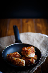 fried pork chops in a frying pan