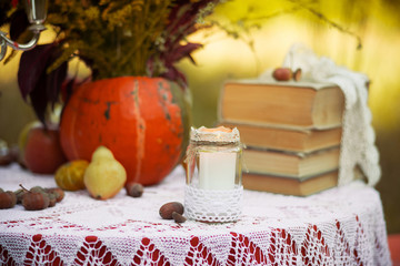 Decorated wedding. Rustic. Wedding decor, wildflowers, bouquet, table setting, candles, pumpkin