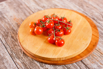 cherry tomatoes on a wooden board