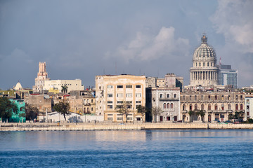 Fototapeta na wymiar Old Havana buildings along the bay with a view of the Capitol