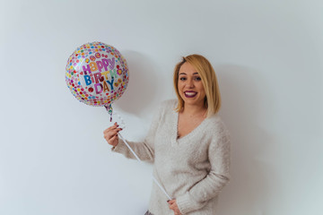 Pretty girl with birthday balloon
