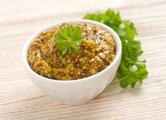 french mustard on a wooden background