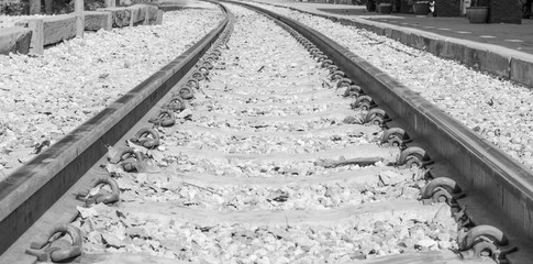 Old railroad tracks close up background ,black and white tone