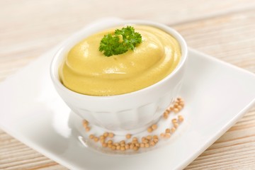 mustard on a wooden background