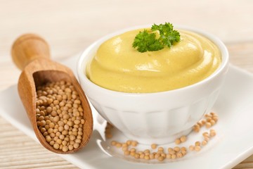 mustard on a wooden background
