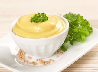 mustard on a wooden background