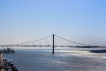 Fototapeta na wymiar Suspension bridge across the Tagus river in Lisbon, Portugal