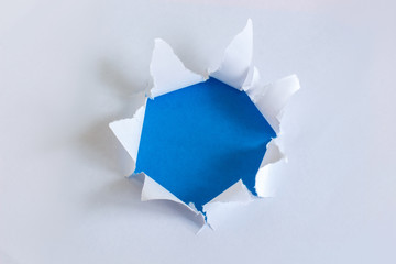 Torn paper with blue background.