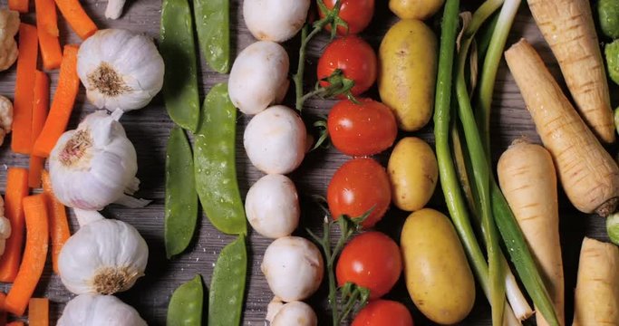Dolly bird eye view of a geometrical pattern of fresh, healthy, organic vegetables