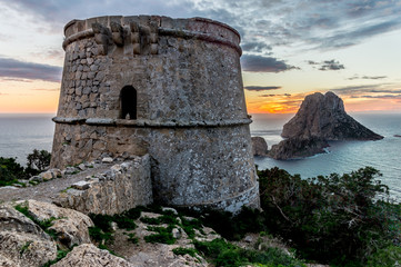 Fototapeta na wymiar Torre des Savinar (Torre del Pirata), and the islands of Es Vedr
