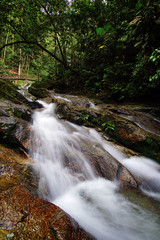 A beautiful waterfall inside tropical rainforest. Long exposure and slow shutter