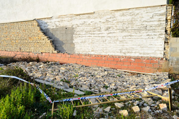 Collapsed block of wall