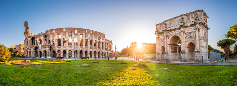 Fototapeta Panoramic view of Colosseum and Constantine arch at sunrise. Rome, Italy