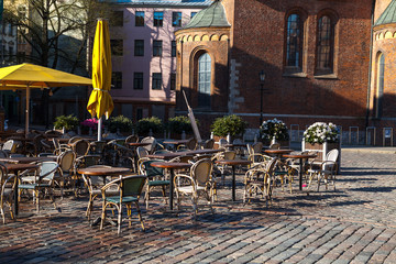 Fototapeta na wymiar Street cafe on the square of old town (Riga, Latvia)