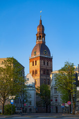 Obraz premium RIGA, LATVIA - 08 MAY 2016: Dome church, street view with green trees