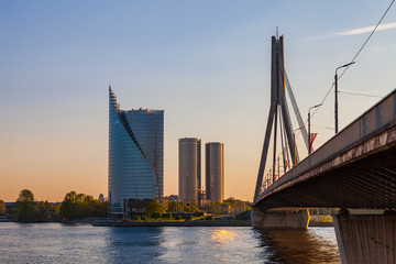 Obraz premium Modern skyscrapers and bridge over Daugava river. Riga, Latvia