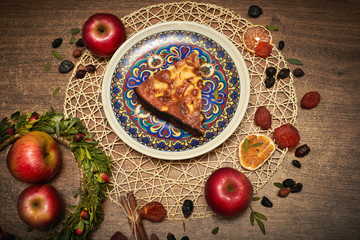 Delicious Apple pie baked at home. Sweet pie stuffed with apples. Apple cake on the table, culinary skills. Favorite dish of children