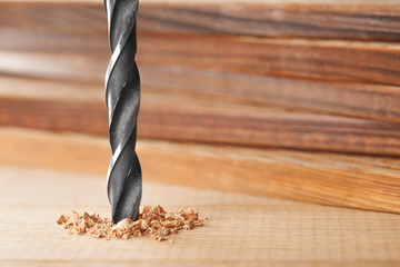 metal drill bit make holes in wooden oaks plank