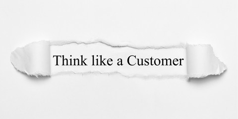 Think like a Customer on white torn paper
