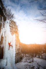 The climber climbs on ice.